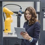 Businesswoman, working in high tech company, using digital tablet